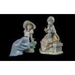 Nao by Lladro Pair of Hand Painted Porcelain Figures. Model Numbers 01042 & 1103. Heights of Figures