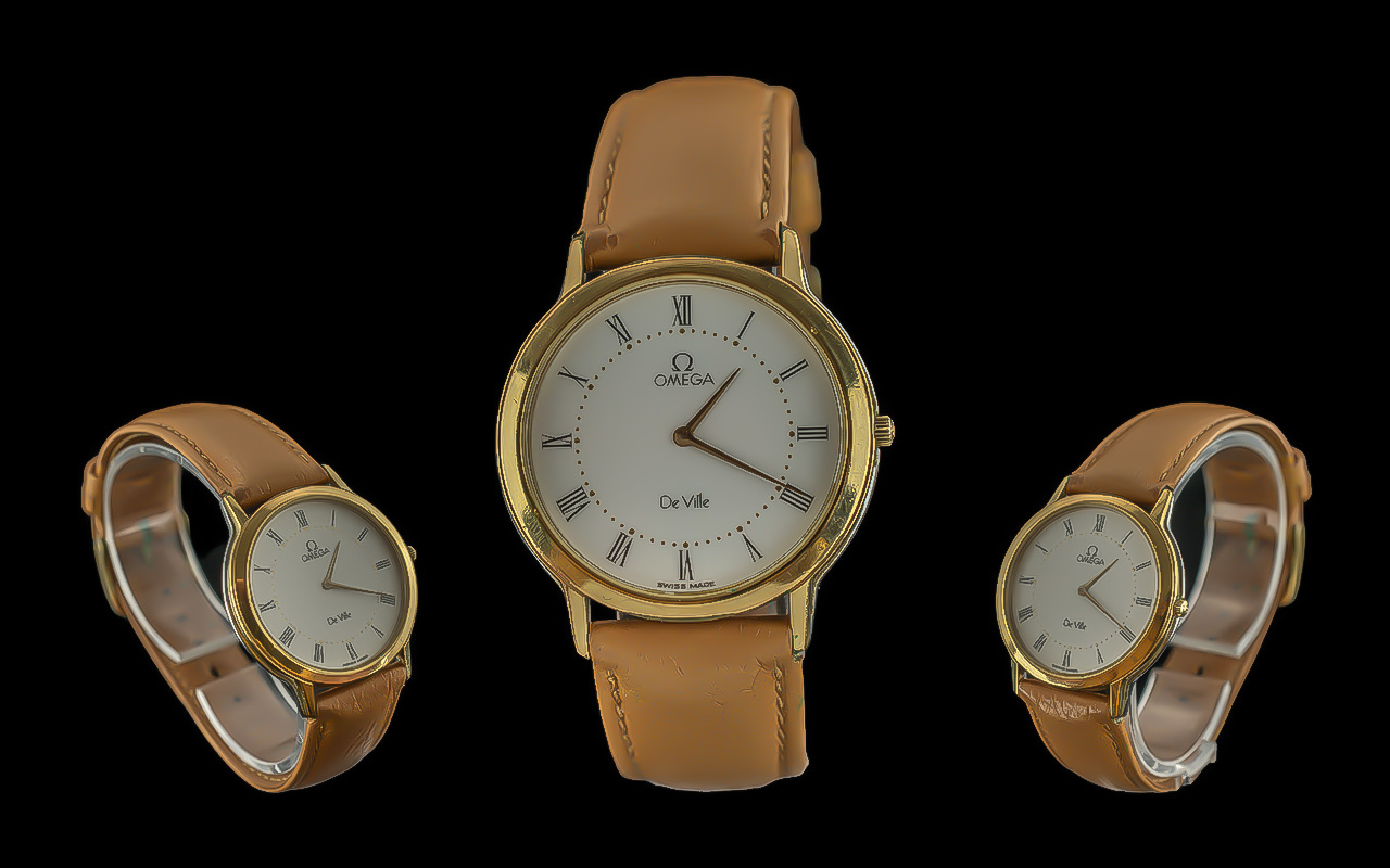 Omega - Deville elegant 18ct gold plated gents quartz wrist watch, with omega tan leather omega