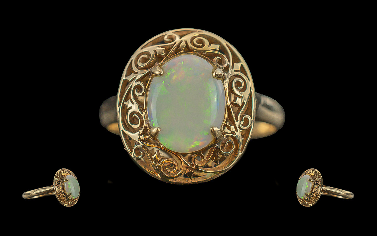 Antique period 18ct gold single stone opal set ring, with open worked ornate mount / shank, marked