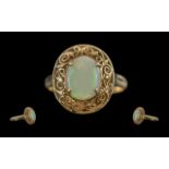 Antique period 18ct gold single stone opal set ring, with open worked ornate mount / shank, marked