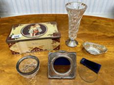 Four Silver Items, including a silver frame (as found), a silver bowl, a silver topped vase, and a