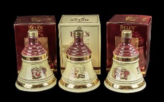 Three Bottles of Bells Old Scotch Whisky Christmas Decanters, full contents, 8 years old, in