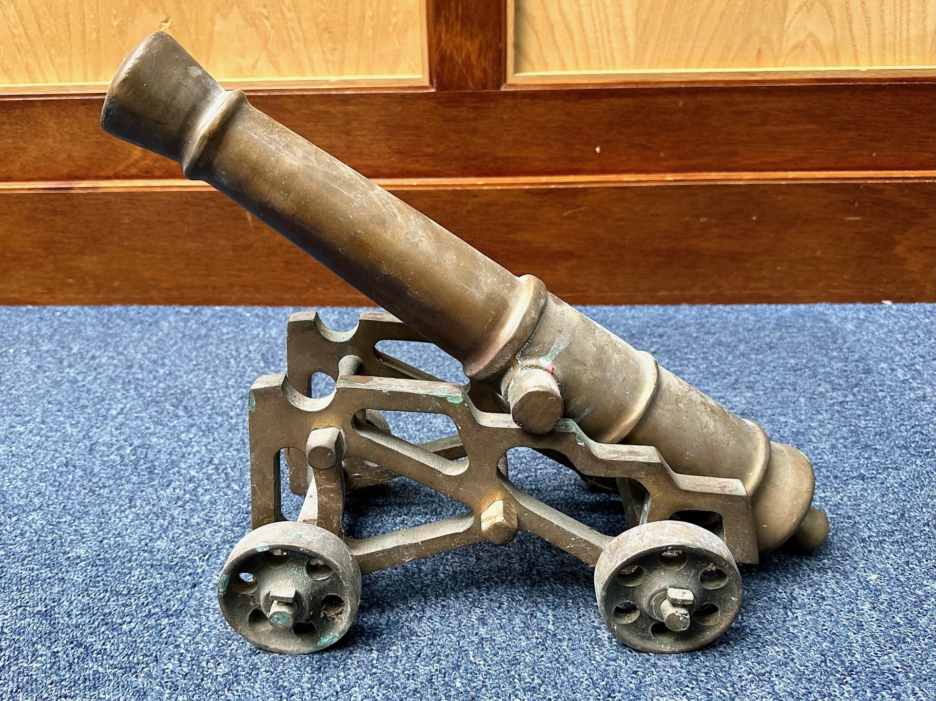 Model of a Bronze Field Cannon, on wheels, measures 18'' long.