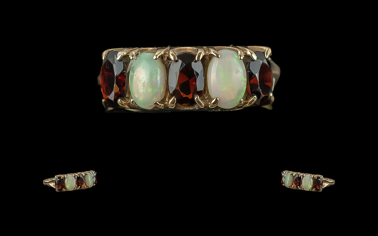 Ladies - Attractive 9ct Gold 5 Stone Opal and Garnet Set Ring. Full Hallmark to Shank. The Opals and