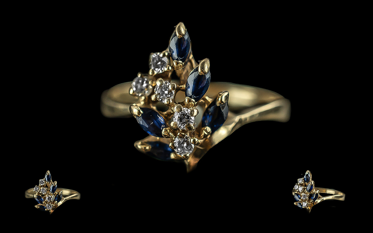 14ct gold sapphire and diamond set cluster ring. not marked but tests gold. sapphires and diamonds