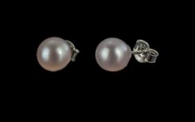 Japanese Akoya Pearl Stud Earrings, two of the high quality, famous Akoya pearls, known for their