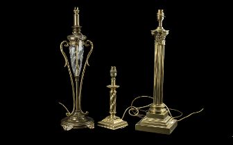 Three Brass Table Lamps, one in the form of a Corinthian column, one in the form of an oil lamp with