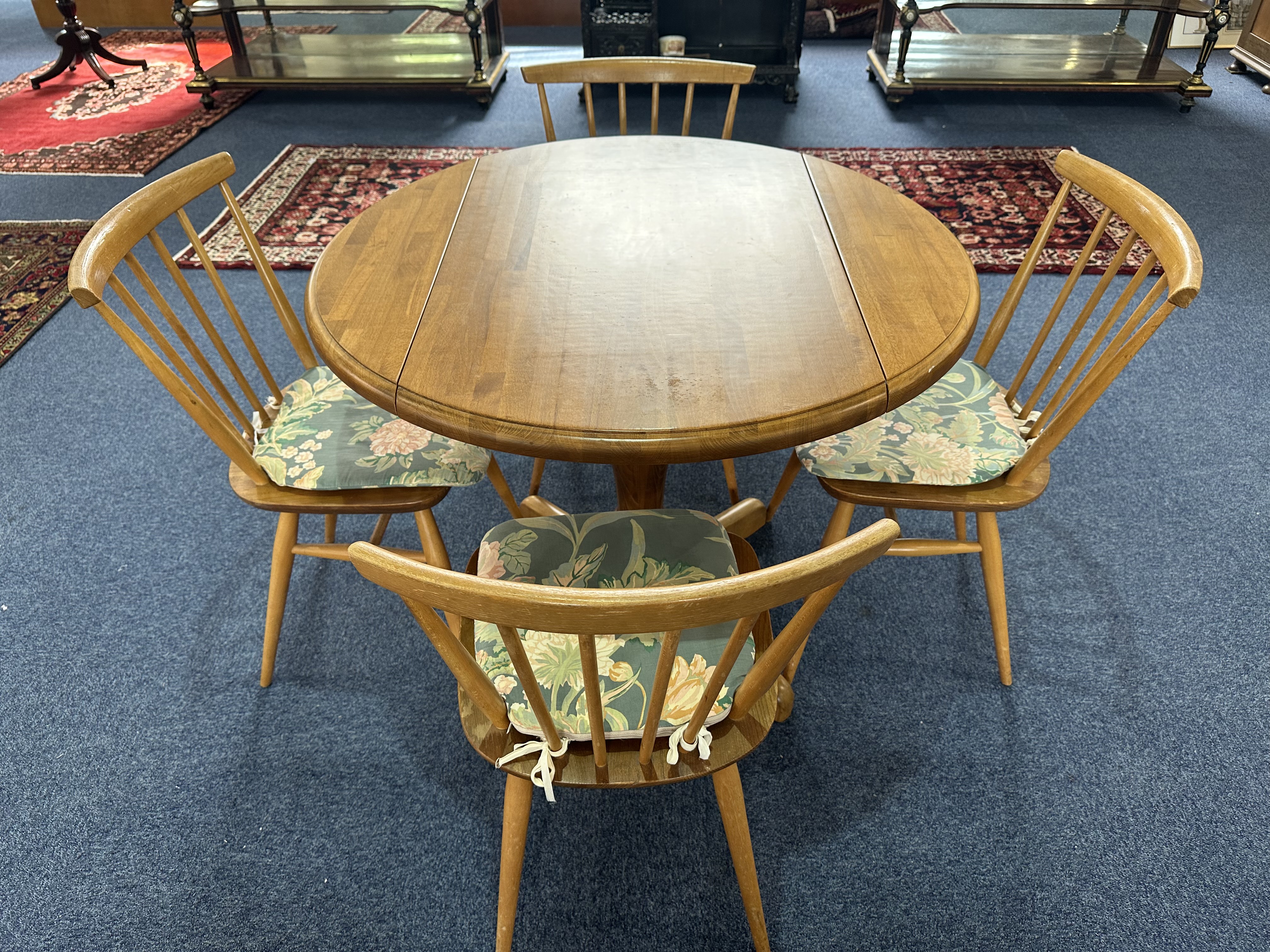 Ercol Small Kitchen Table, drop leaf, central pedestal, and Four Spindle Back Chairs with padded