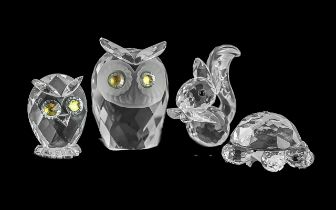 Four Pieces of Swarovski Crystal, all in original boxes, comprising a squirrel, a tortoise, and