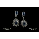 Ladies - pair of 18ct white gold sapphire and diamond set earrings, marked 18ct, pear shaped