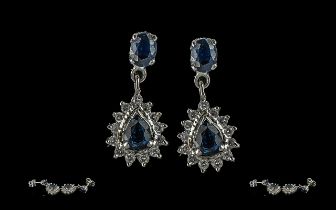 Ladies - pair of 18ct white gold sapphire and diamond set earrings, marked 18ct, pear shaped