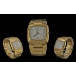 Gentleman's Gucci Quartz Wristwatch, gold plated, date aperture. White face, gold baton markers.