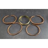 Five Hand Made Copper & Brass African Bangles, assorted finishes.