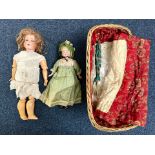 Antique German Bisque Doll, moving limbs, glass eyes and painted lips showing teeth, in need of