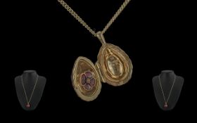 Theo Faberge, Grandson of Carl Faberge, Red Enamel Silver Gilt Egg Shaped Pendant, with attached 9ct