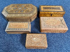 Five Wooden Boxes, profusely carved, assorted sizes, largest 15'' x 9''.