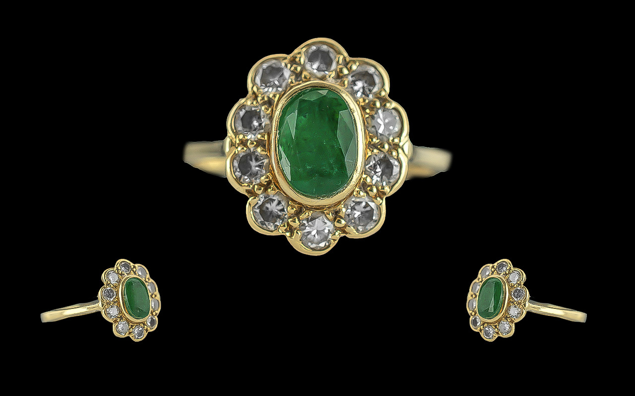 Ladies 18ct gold emerald and diamond set cluster ring. full hallmark to interior of shank. the