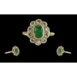 Ladies 18ct gold emerald and diamond set cluster ring. full hallmark to interior of shank. the