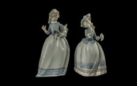 Nao by Lladro Pair of Hand Painted Porcelain Figures. Model Numbers 469 & 472. Young Women In Long