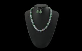 Lavender Jade Beaded Necklace, 18'' length, together with a pair of jade drop earrings.