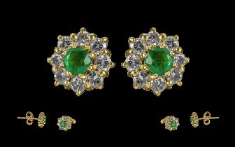 Ladies - pleasing 18ct gold diamond and emerald set pair of earrings. marked 750 - 18ct. the central