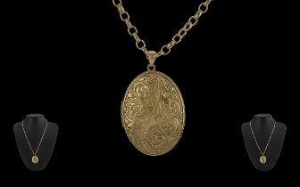 A Fine 9ct Gold Two Sided Oval Shaped Hinged Locket - Attached To A 9ct Gold Belcher Chain. Both