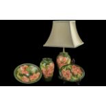 Collection of Moorcroft 'Coral Hibiscus' pattern, comprising a table lamp with shade, a matching