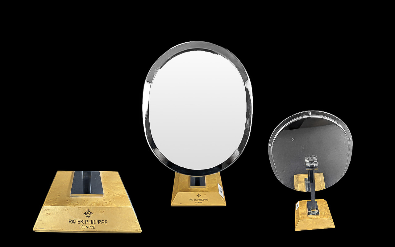 Patek Philippe Geneve Desk Top Oval Mirror on maple wood base, chrome plated framed mirror, engraved