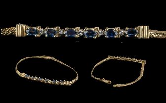 Ladies Pleasing 14ct Gold Blue Sapphire and Diamond Set Elegant Bracelet Marked 585 14ct. The Blue