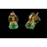 Pair of Emerald Stud Earrings, the oval cut emeralds of excellent colour, set in classic style, with