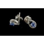 Sapphire Solitaire Drop Shaped Stud Earrings, oval cut sapphires, each set within an open teardrop