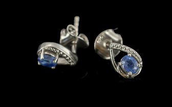 Sapphire Solitaire Drop Shaped Stud Earrings, oval cut sapphires, each set within an open teardrop