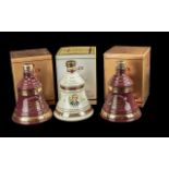 Three Bottles of Bells Old Scotch Whisky Christmas Decanters, full contents, 8 years old, in