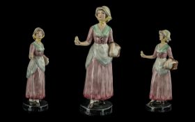 Goldschider hand painted figure ' young victorian female with basket ' goldschider marks to base.