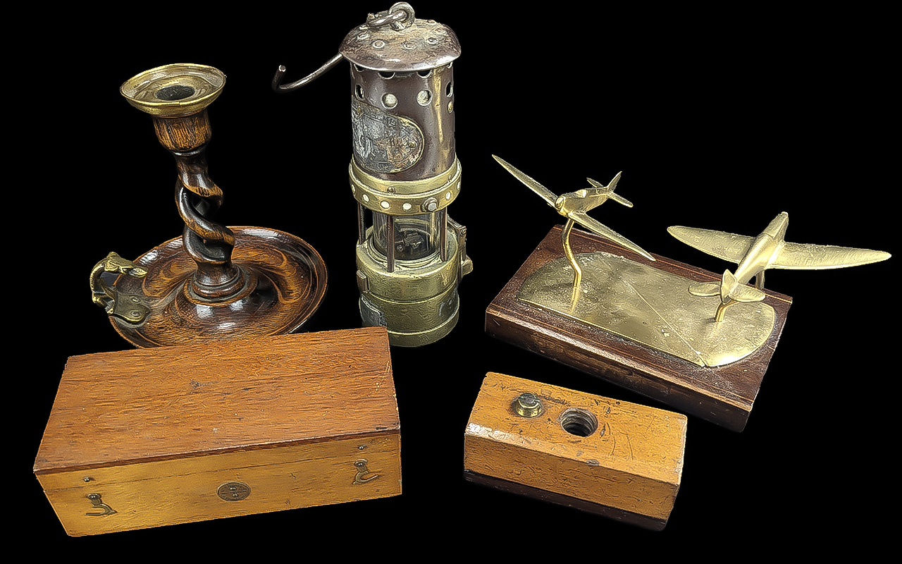 Box of Collectibles, including a brass desk aeroplane, small brass oil lamp No. 46, wooden twist