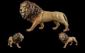 Beswick hand painted wild animal figure ' lion ' facing left. model no 2089. designer graham tongue.