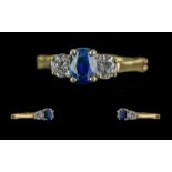 14ct Gold Three Stone Ring, Central Sapphire set between two brilliant cut diamonds, est. total