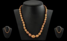 A Vintage Excellent Butterscotch Amber Graduated Beaded Necklace with Gold Clasp. Excellent