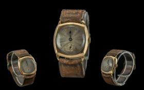 Gents 9ct gold mechanical wrist watch. marked to interior of back cover. with original calf