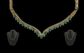 Ladies - 14ct gold pleasing quality emerald and diamond set necklace. the emeralds and diamonds of