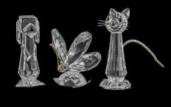 Three Swarovski Crystal Figures, two in original boxes, comprising a butterfly with gold tone