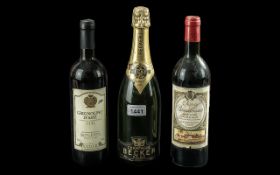 A Collection of Alcohol consisting of a Becker Reims Brut 1975 Bottle of Champagne, a bottle of