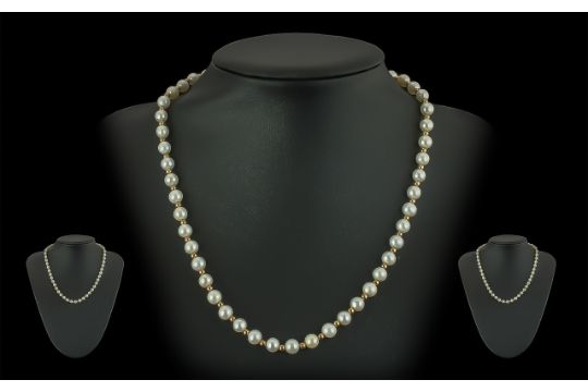 Ladies Pleasing Quality 9ct Gold Pearl and Gold Spacers Set Necklace, marked 9.375, the cultured