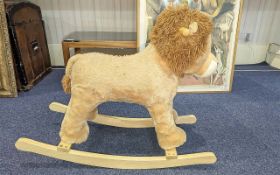 Child's Rocking Lion, raised on wooden rockers, cream fur, for the younger child,