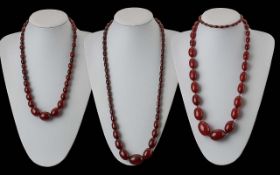 Three Reconstituted Cherry Amber/ Resin Necklaces, various lengths,