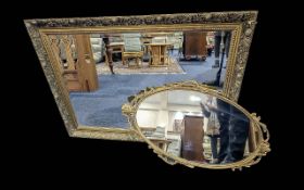 Two Decorative Mirrors, comprising a large over mantle mirror with bevelled edges,