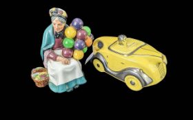 Royal Doulton 'The Old Balloon Seller' HN1315, together with a Sadler yellow tea pot in the form