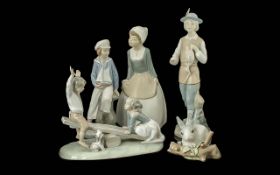 Three Lladro & Two Spanish Figures, comprising a Lladro Bunny 1977, a Lladro figural set of children