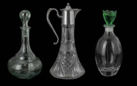 Cut Glass Claret Jug, with silver plated lid, together with two decanters with decorative stoppers.
