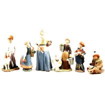 Six Lladro figurines and a pot.